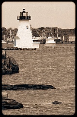 Palmer Island Light Guides Boat Out of the Harbor -Sepia Tone